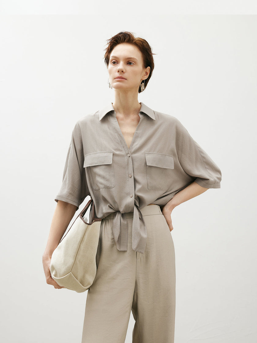 Beige shirt with bow