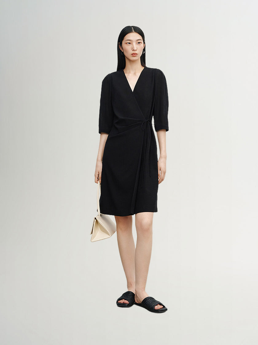 Black dress with round neck and long sleeves, high waist