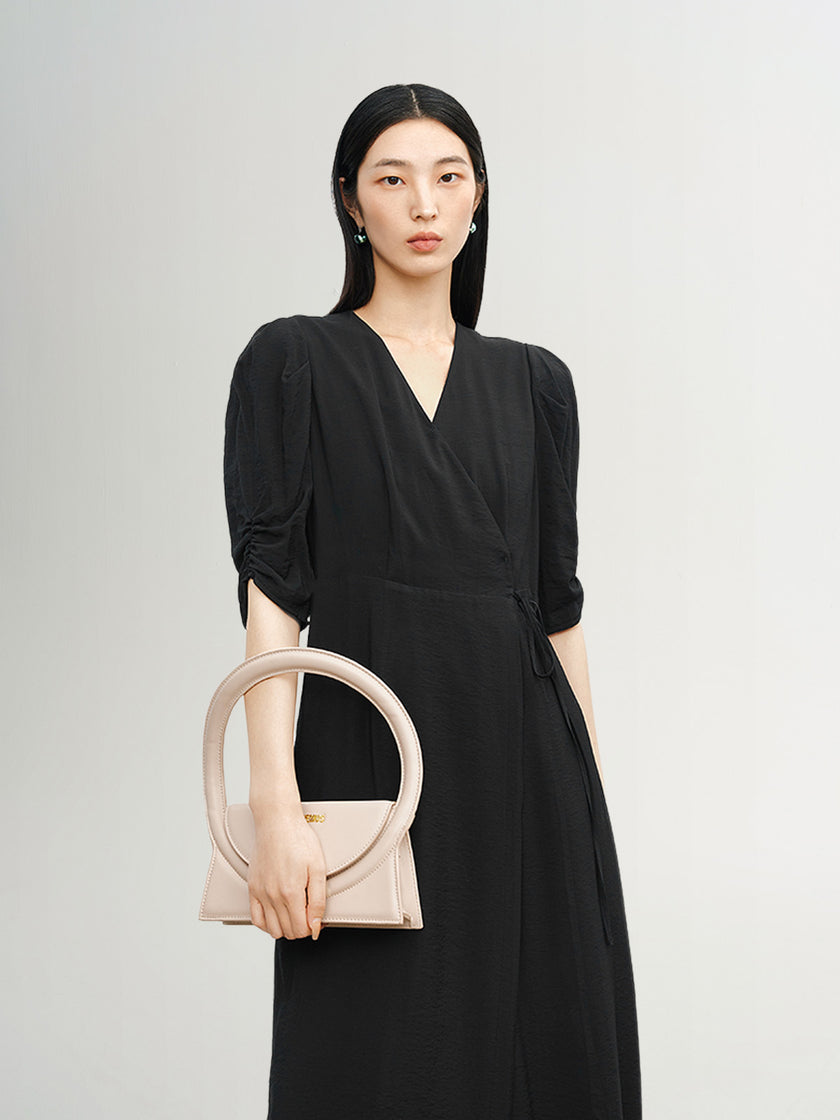 Black V-neck dress with puff sleeves