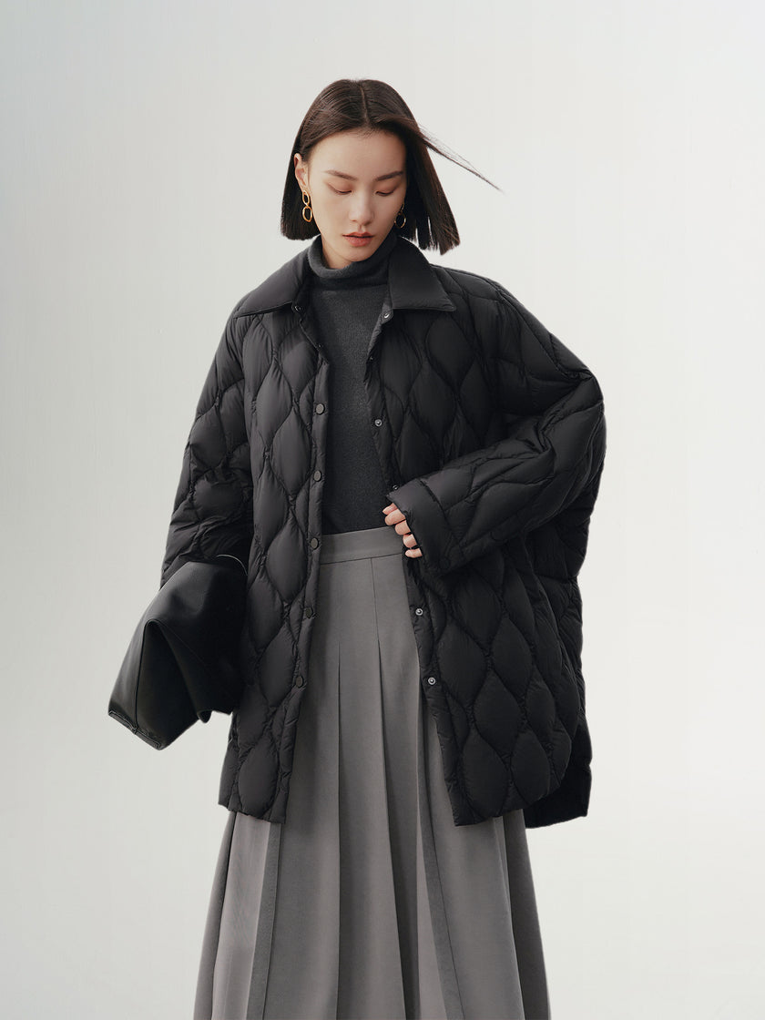 Black quilted hooded jacket with pattern