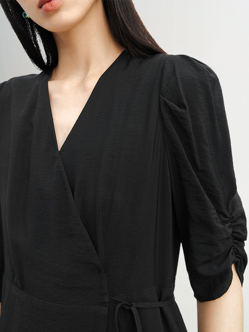 Black V-neck dress with puff sleeves