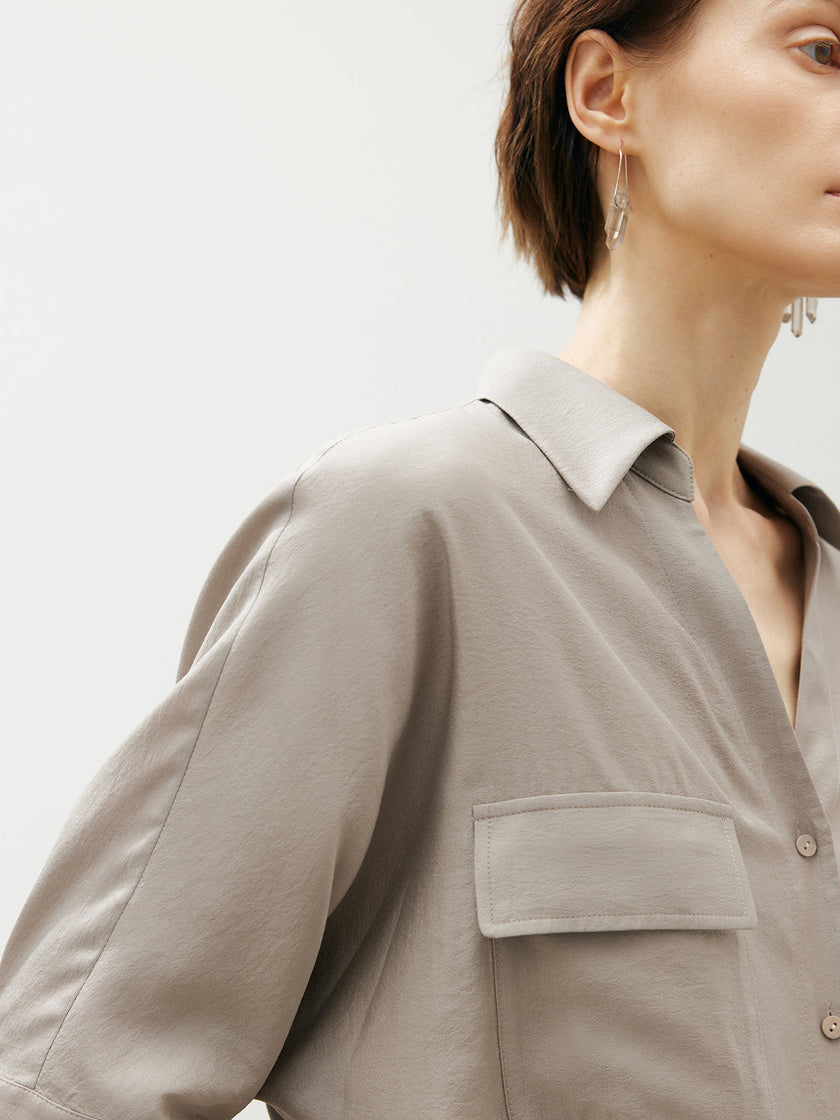 Beige shirt with bow