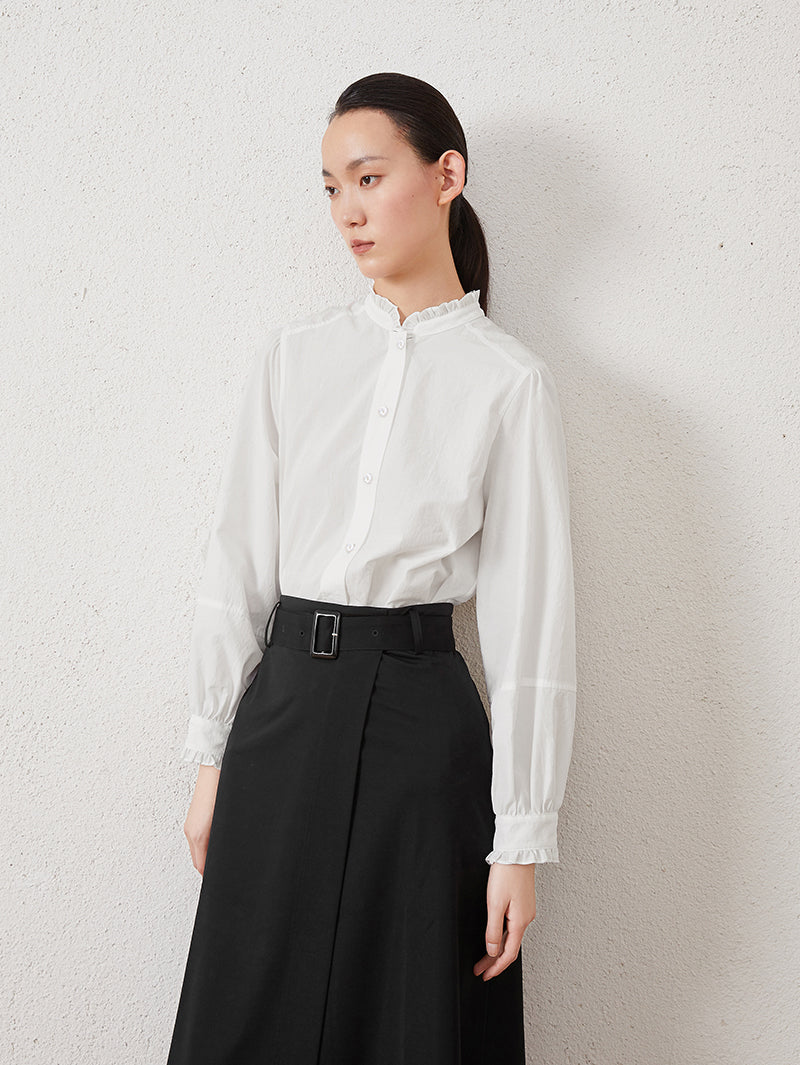 White long-sleeved blouse with pleated collar