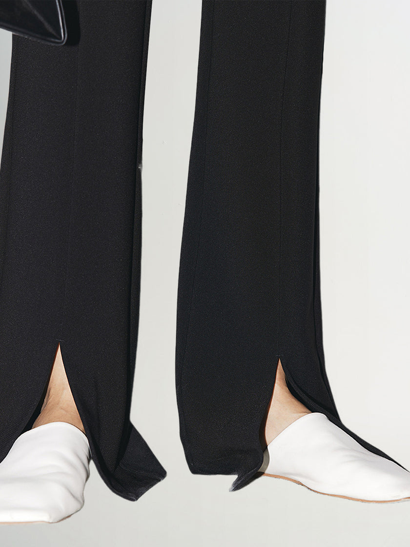 Black slim fit pants with a high waist and a slightly flared leg