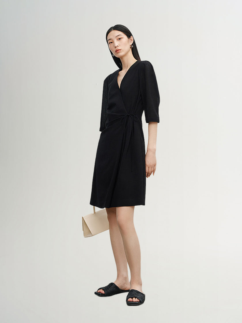Black dress with round neck and long sleeves, high waist
