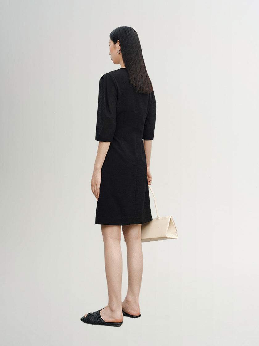 Black dress with round neck and long sleeves, high waist