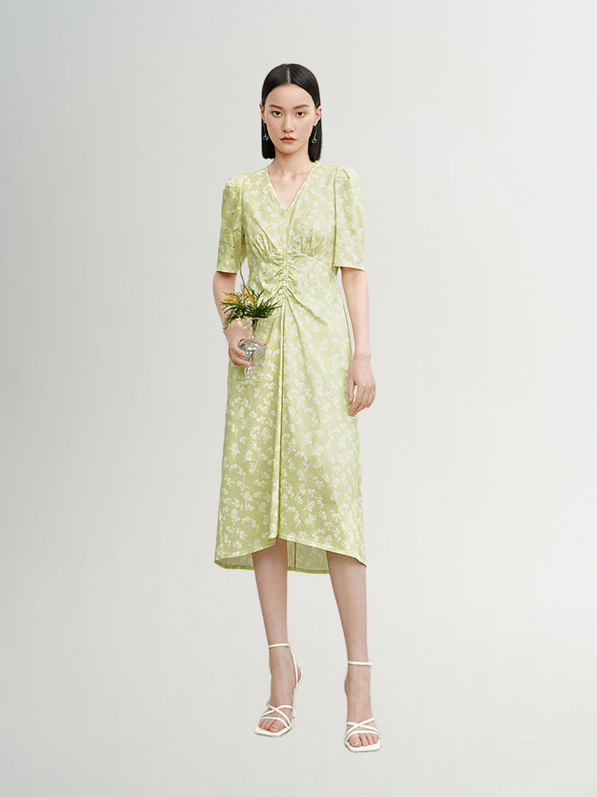 Green floral print dress with V-neck and pleated design
