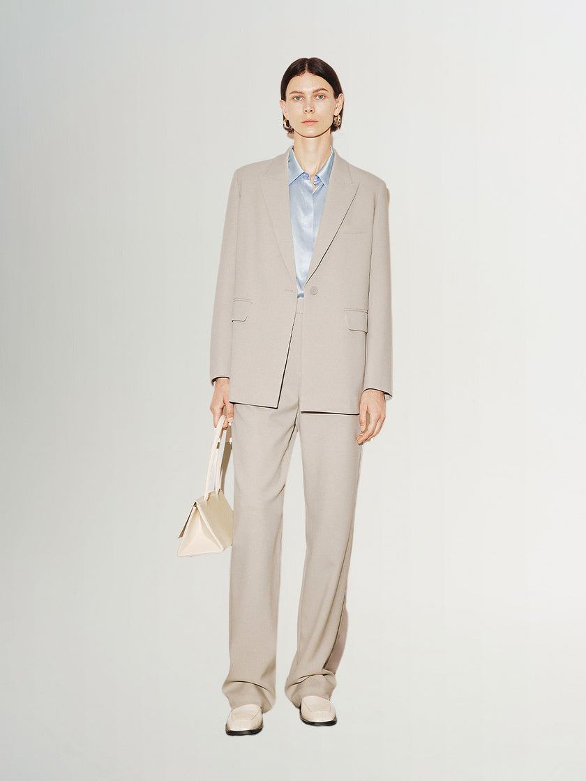 Light beige buttoned long sleeve blazer