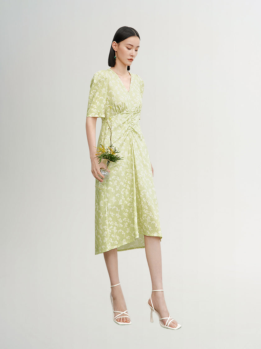 Green floral print dress with V-neck and pleated design
