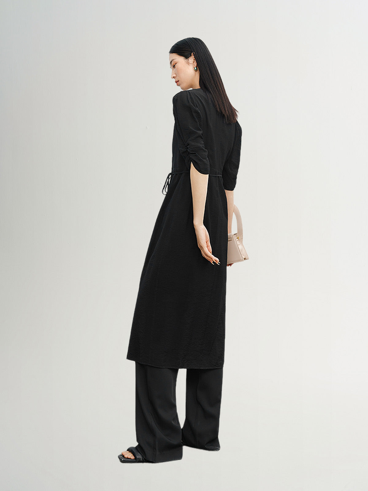 Black V-neck dress with puff sleeves