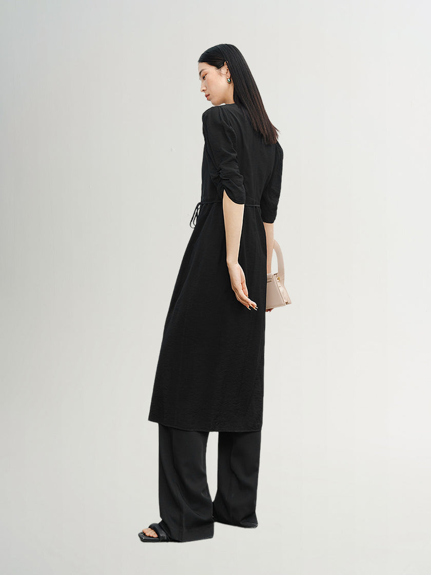 Black V-neck dress with puff sleeves