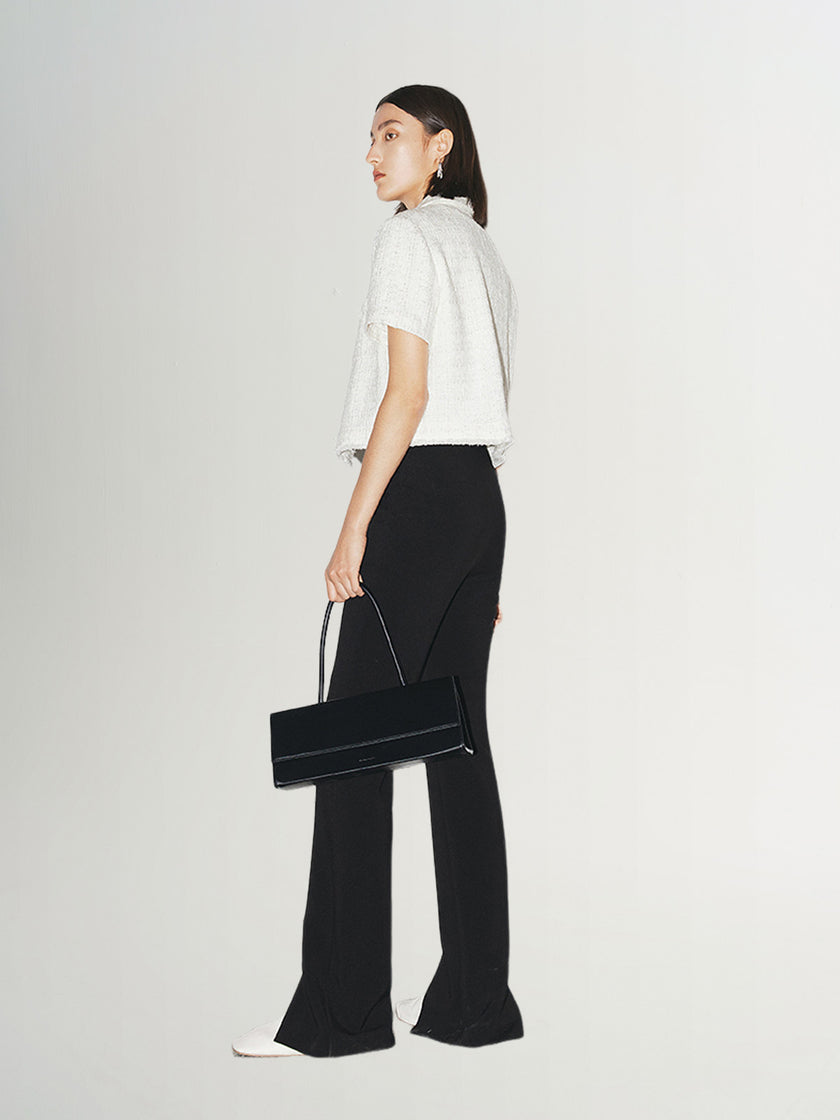 Black slim fit pants with a high waist and a slightly flared leg