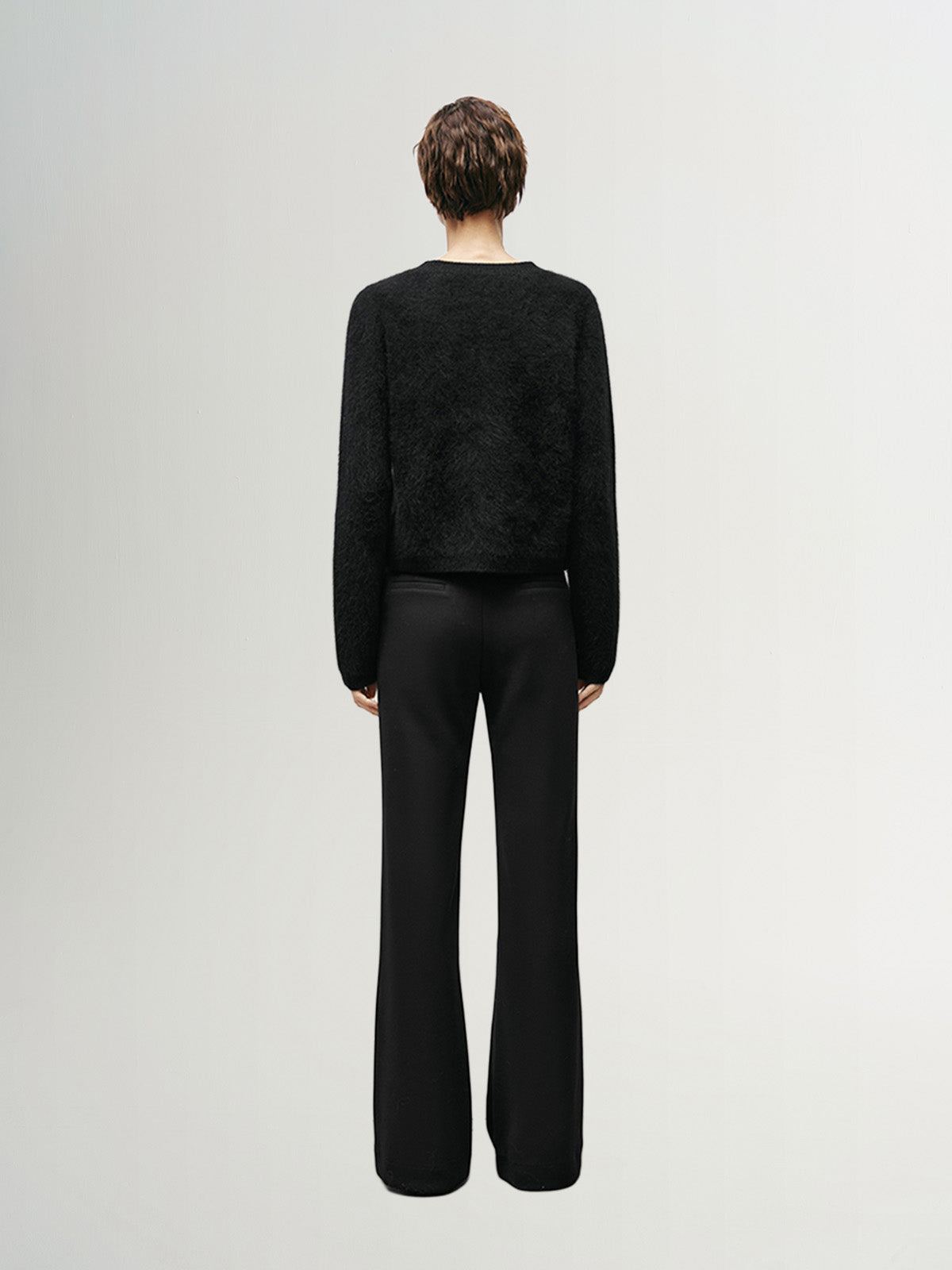 Black wool knit cardigan with round neck and buttons