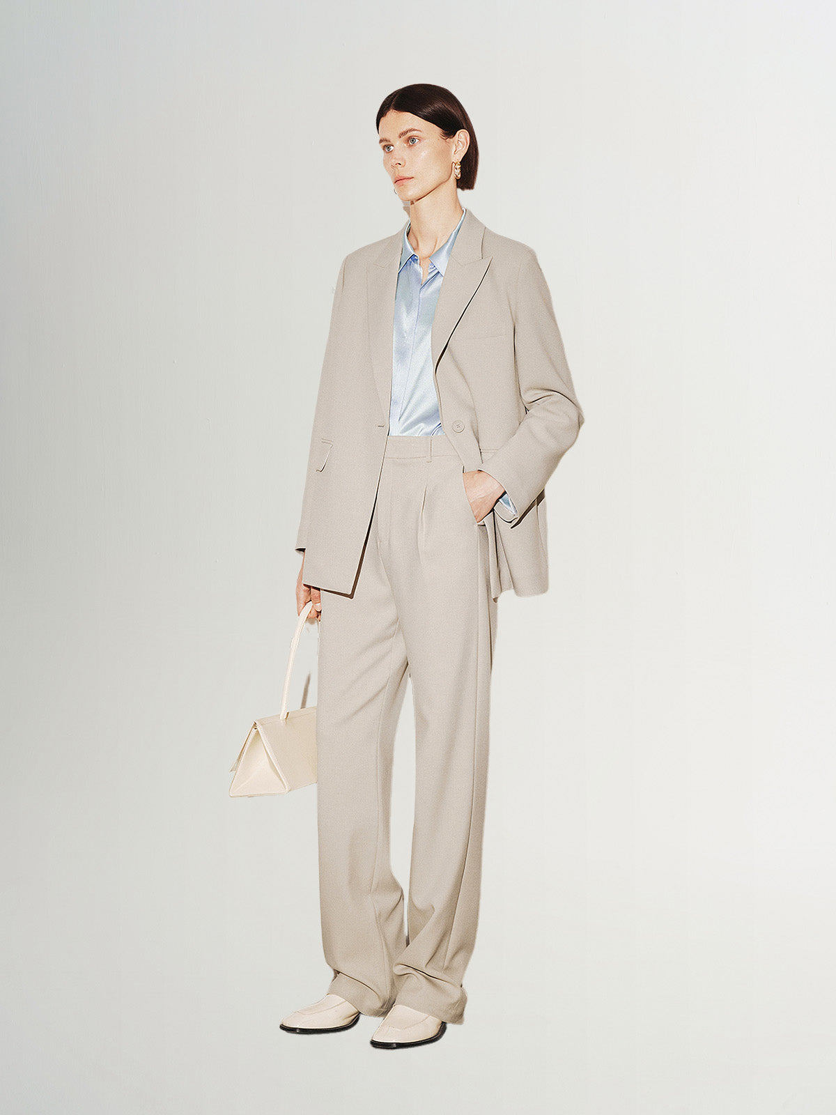 Light beige buttoned long sleeve blazer