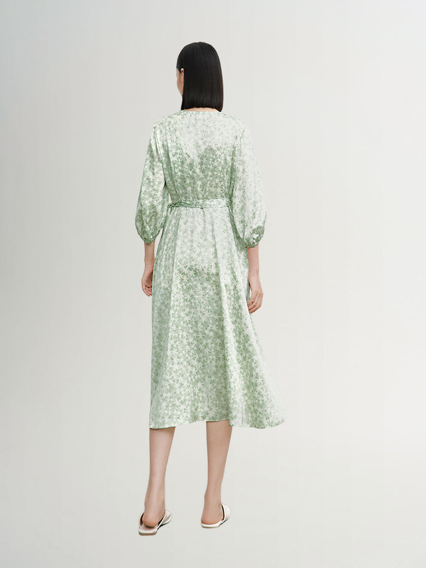 Mint green floral print dress with a v-neck, crossover cut and an irregular hem