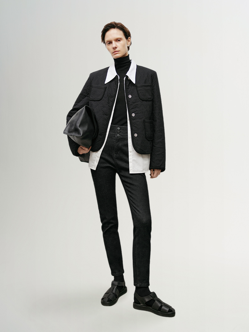 Black quilted jacket with round neck and buttons