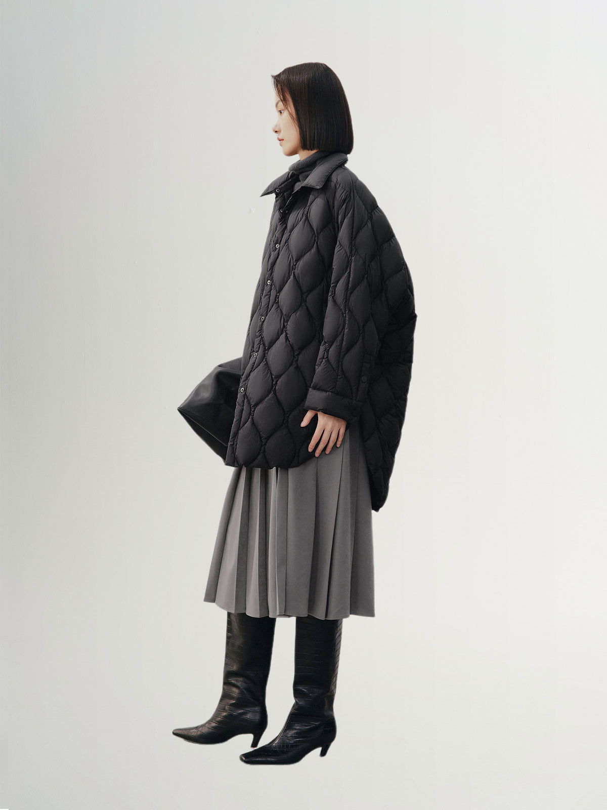 Black quilted hooded jacket with pattern