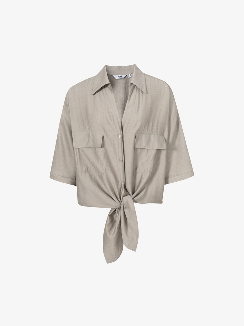 Beige shirt with bow