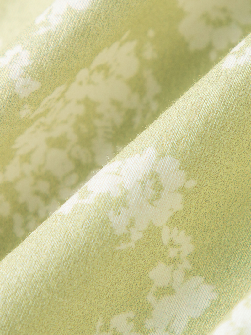 Green floral print dress with V-neck and pleated design