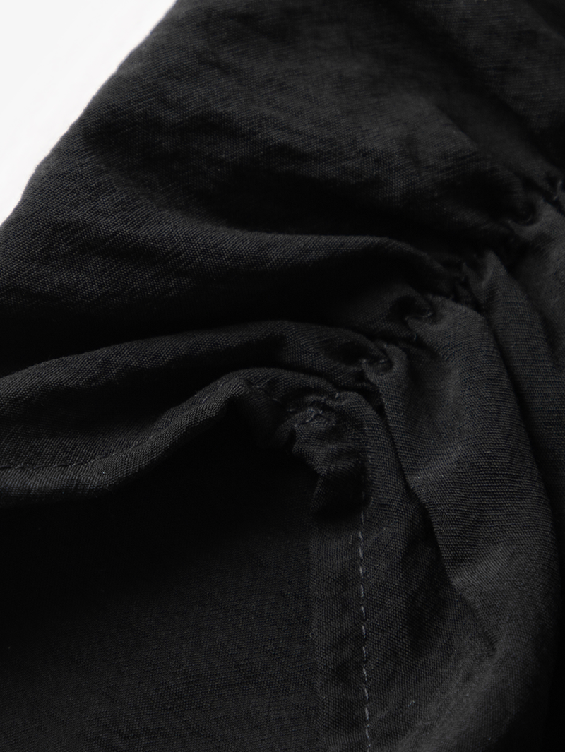 Black V-neck dress with puff sleeves
