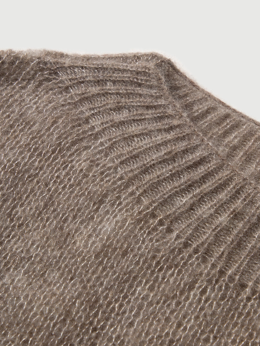 Close-up of a textured brown fabric surface