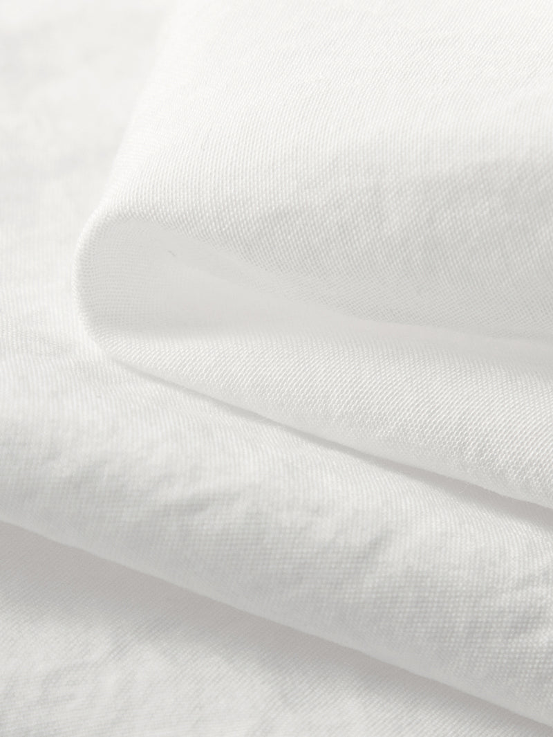 White long-sleeved blouse with pleated collar