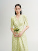 Green floral print dress with V-neck and pleated design
