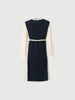 Black dress with round neck, long sleeves and belt
