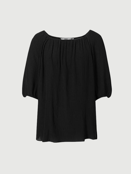 Blouse en soie noire à col rond et manches courtes