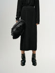 Black and shiny long knitted skirt