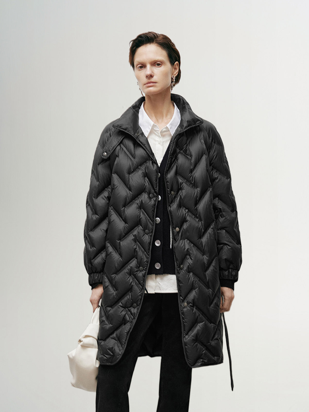 Black mid-length down jacket with hood and belt