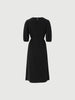 Black silk dress with puffed sleeves and boat neck