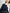Navy blue mid-length trench coat with button fastening and belt