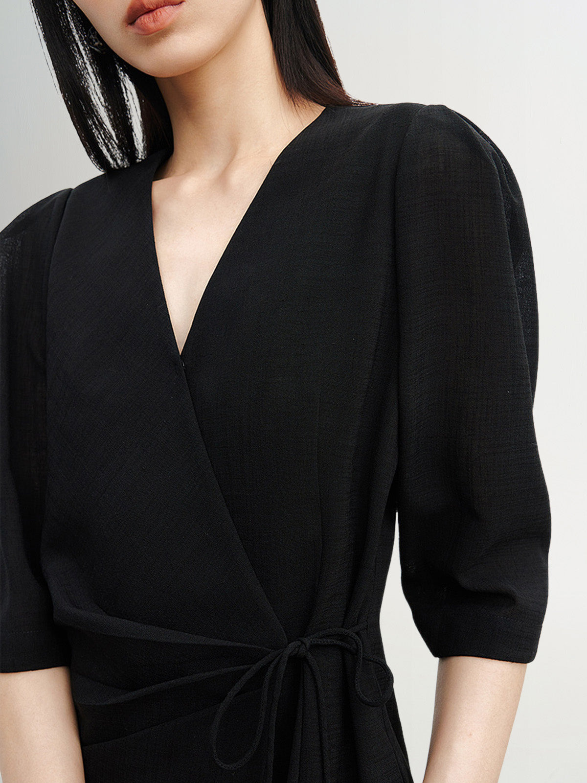 Black dress with round neck and long sleeves, high waist