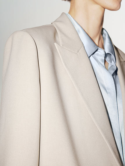 Light beige buttoned long sleeve blazer