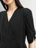 Black V-neck dress with puff sleeves