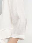 White blazer with special texture, notched lapel collar, double breasted