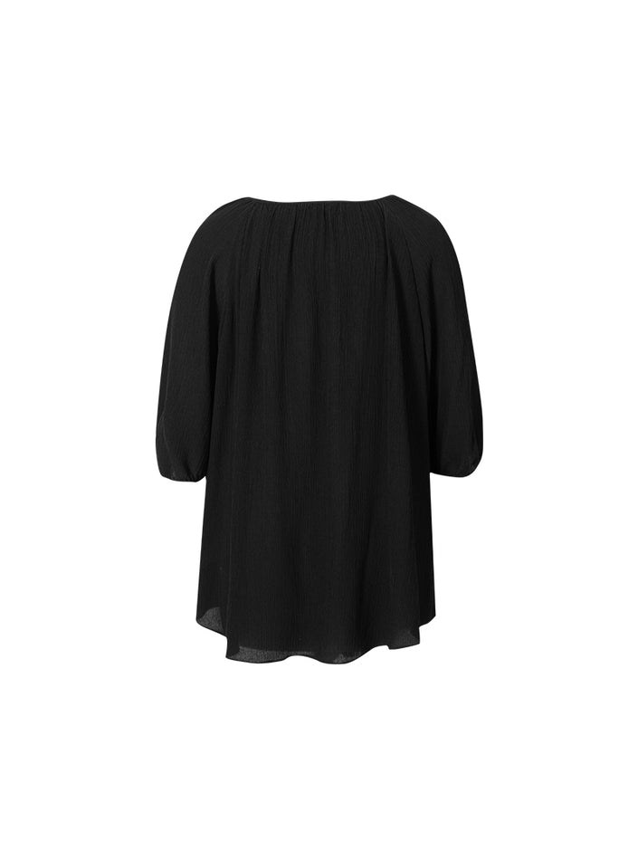 Blouse en soie noire à col rond et manches courtes