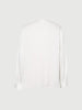 Chemise blanche à col en V et manches longues en soie