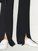 Black slim fit pants with a high waist and a slightly flared leg