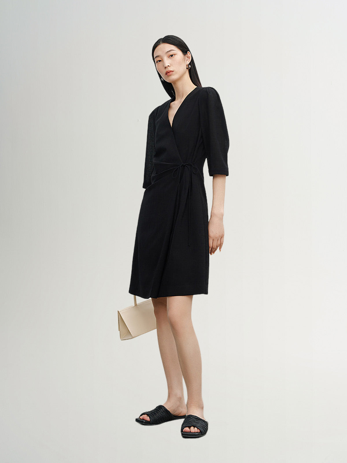 Black dress with round neck and long sleeves, high waist