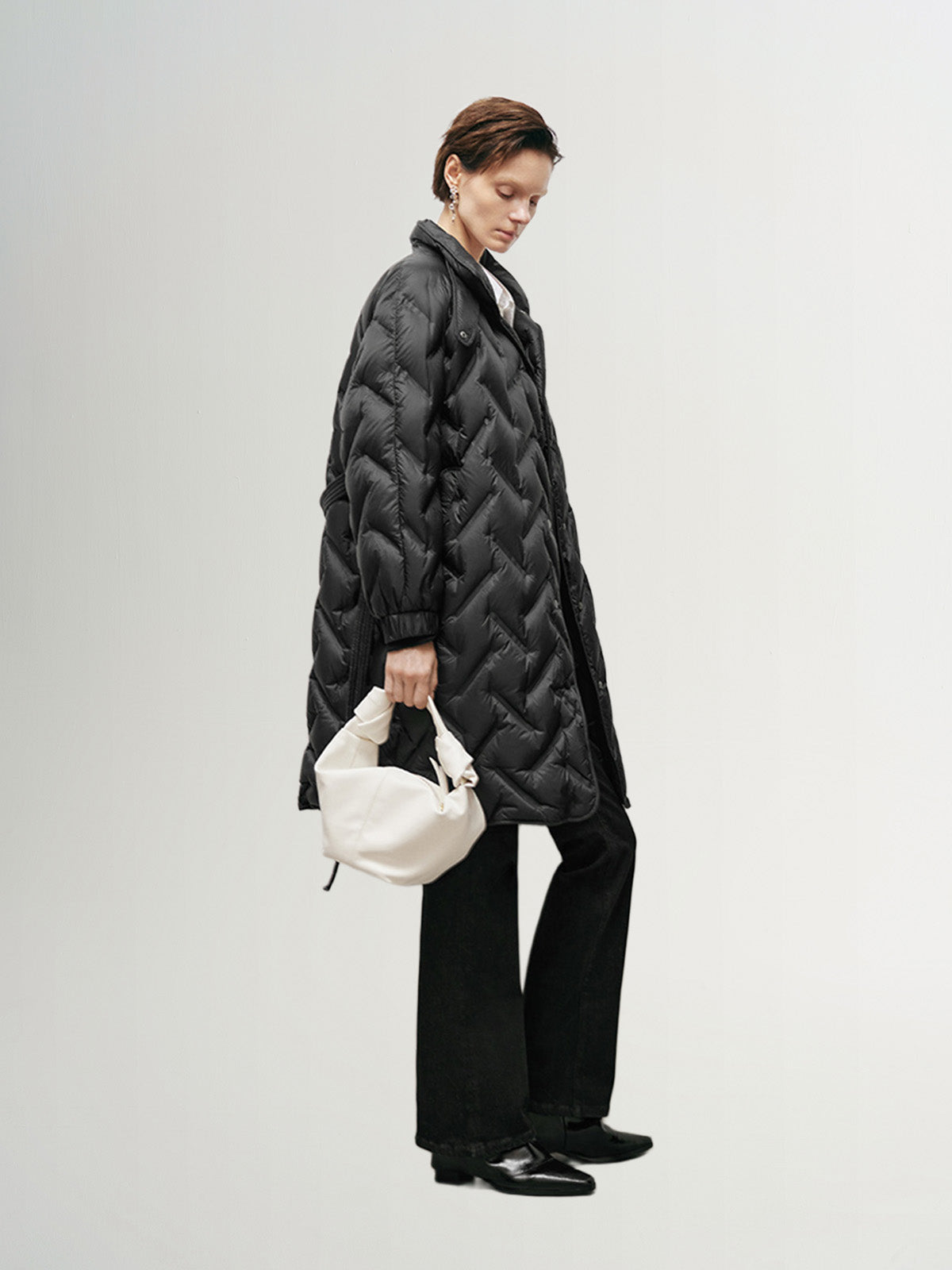 Black mid-length down jacket with hood and belt