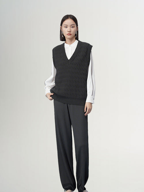 Load image 1 in gallery view. Dark gray V-neck knitted vest