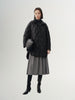 Black quilted hooded jacket with pattern