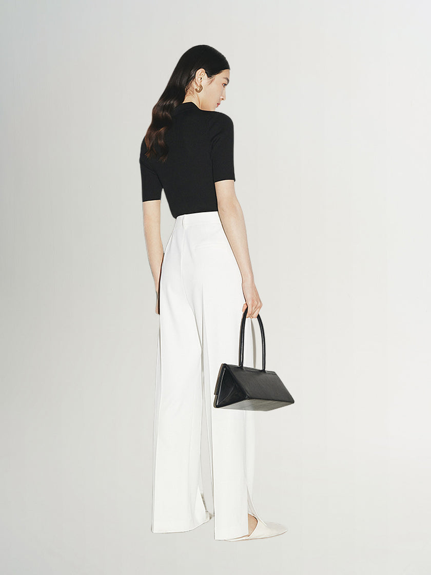 Top tricoté noir à col polo zippé, manches courtes