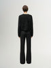 Black wool knit cardigan with round neck and buttons