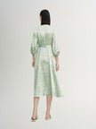 Mint green floral print dress with a v-neck, crossover cut and an irregular hem