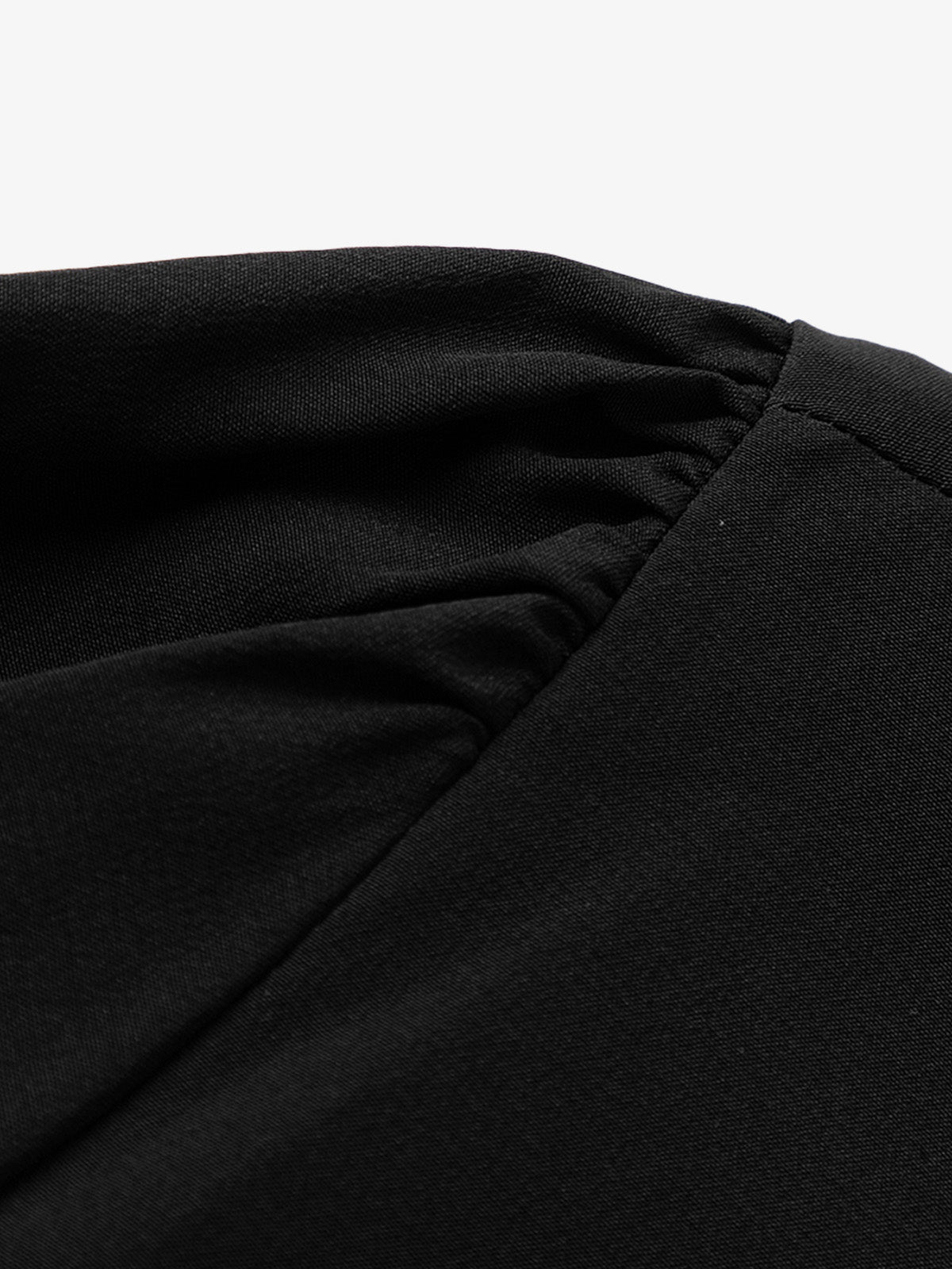 Black silk dress with puffed sleeves and boat neck