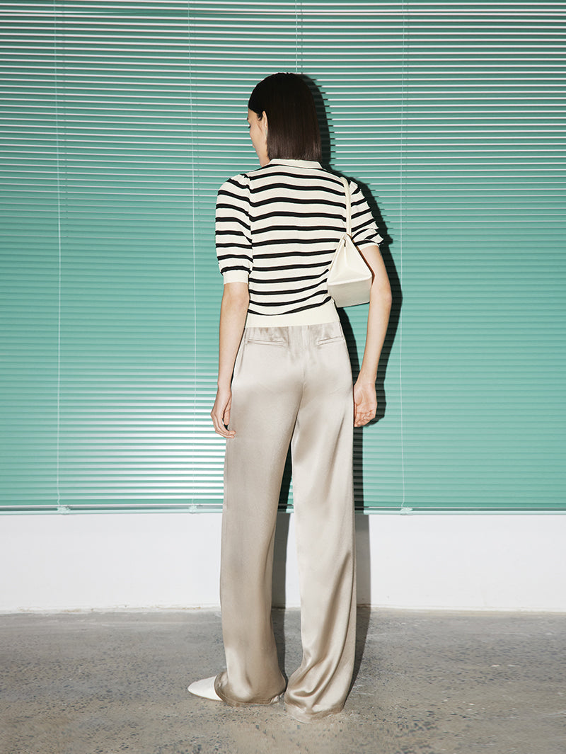 Top en tricot beige et noir à rayures