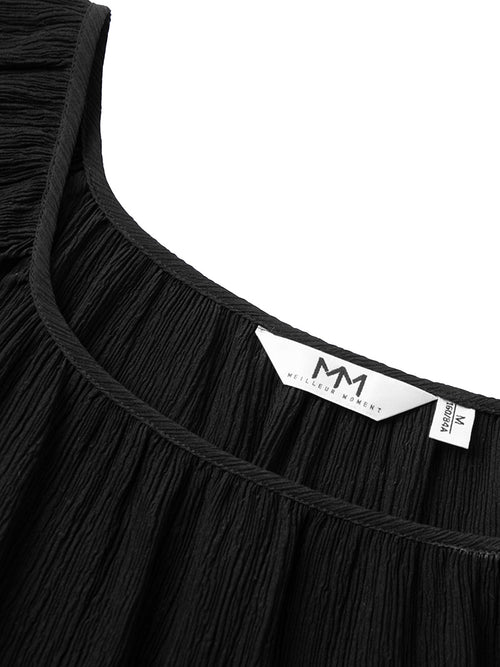 Charger l'image 1 dans la galerie. Blouse en soie noire à col rond et manches courtes